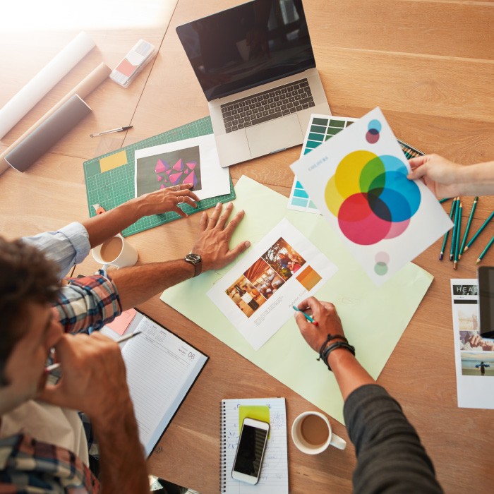 close-up of professionals working on art assets
